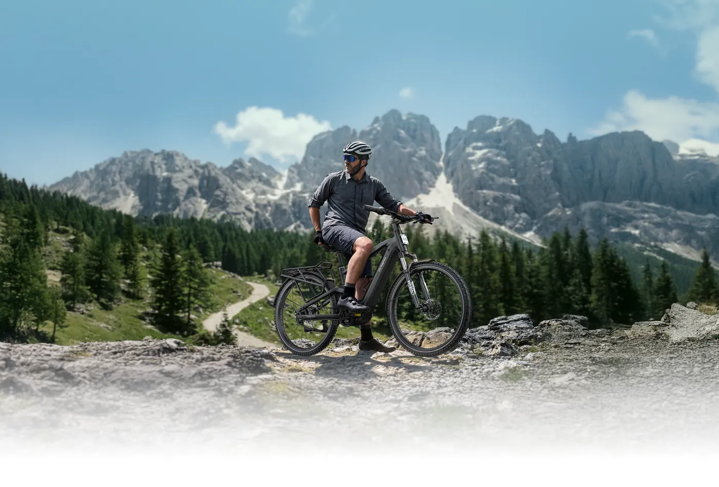 Rider on a MapFour Roam trekking e-bike in the mountains